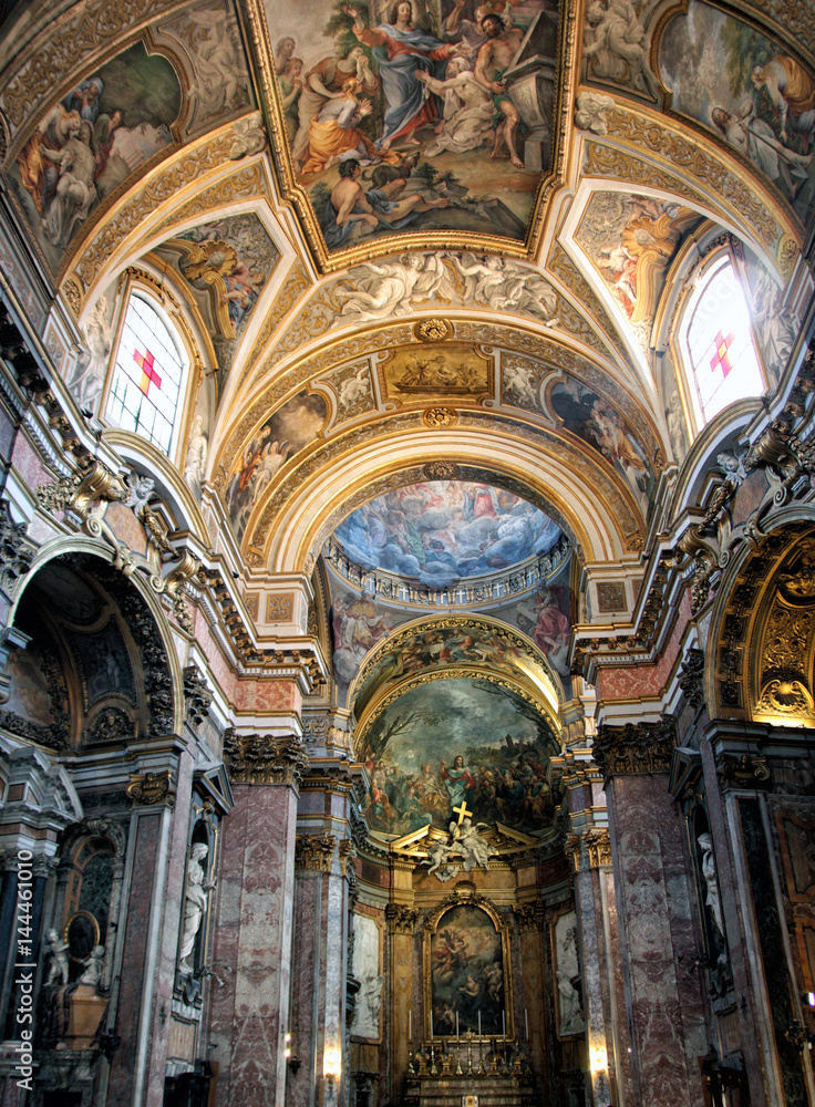 gorgeous ornate interior of the Catholic Cathedral with its painted walls and ceiling, and frescoes in Rome