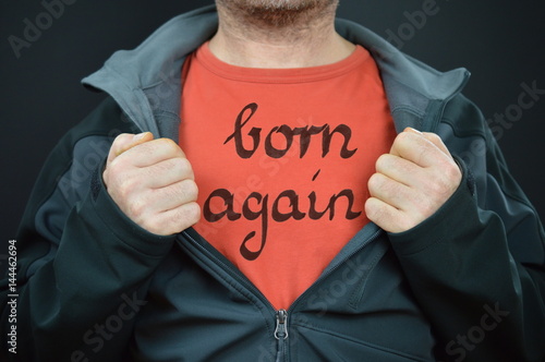 a man with the words born again on his red t-shirt 