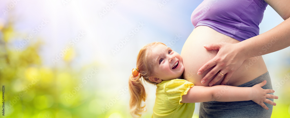 Happy Sister Hugging Pregnant Mother
 - obrazy, fototapety, plakaty 