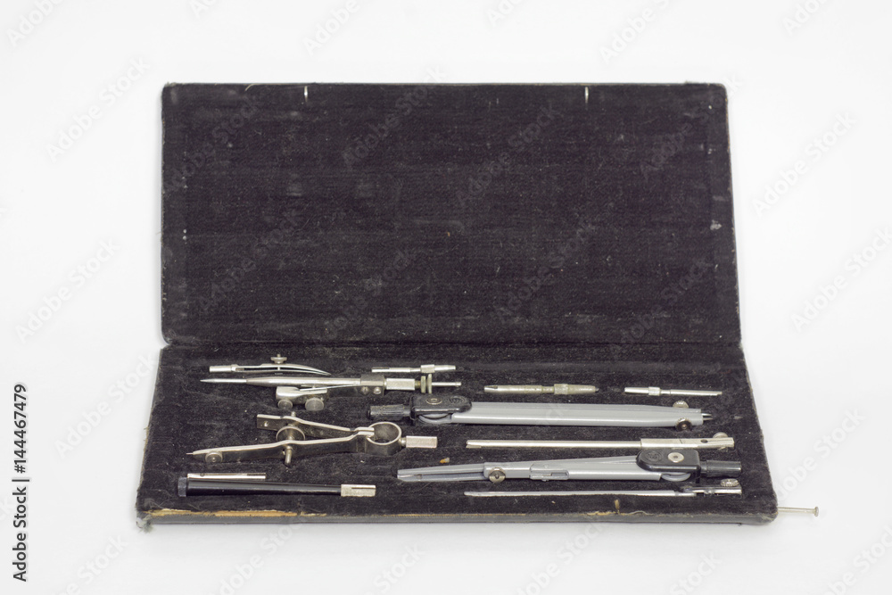 Set of precision technical drawing instruments in black case. Open Set of precision technical drawing instruments in black case. Open