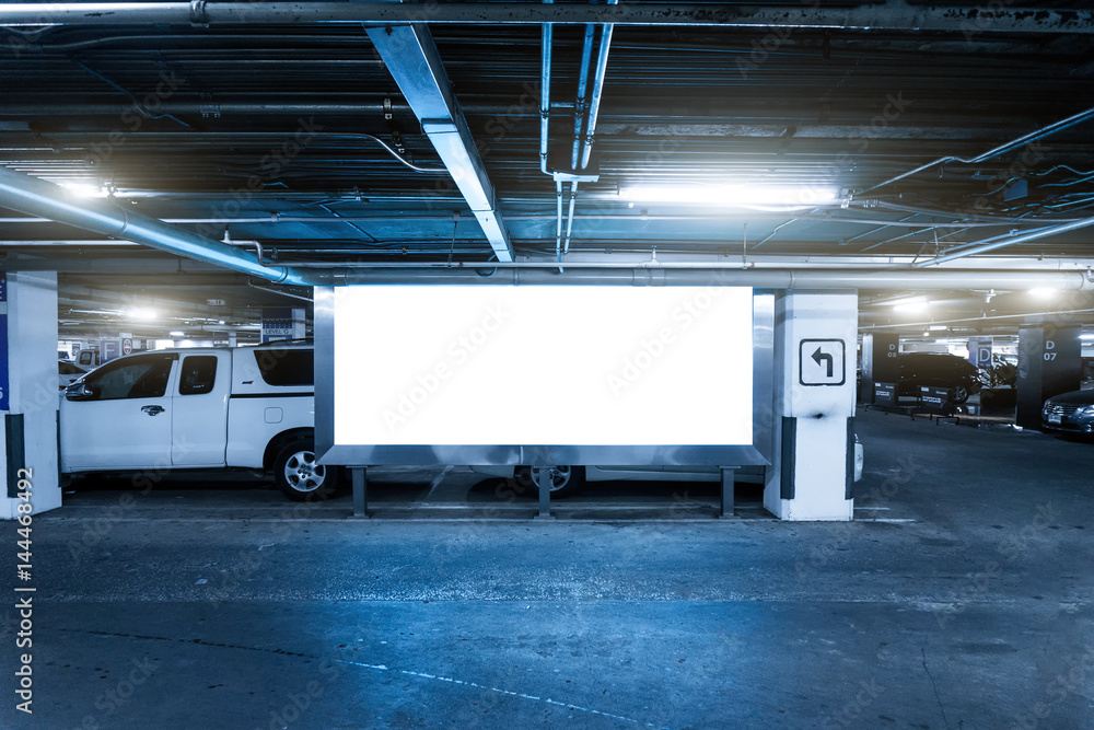 Parking lot underground interior with blank billboard,Blank area panel for advertise and decoration,Cool tone color effect.