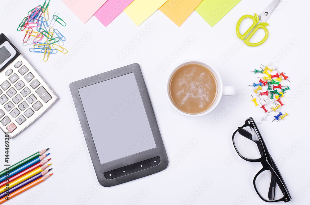 School and office supplies, tablet and glasses on a white background. School and office supplies, tablet and glasses on a white background.