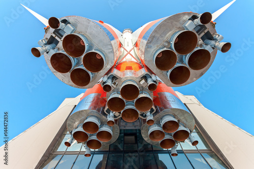 Russian space transport rocket with rocket engines against the blue sky