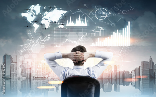 Man looking at graphs in city