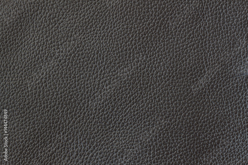 Texture of genuine leather close-up, cowhide. Black color. For natural, artisan backgrounds, substrate composition use, vintage design. Concept of shopping, manufacturing