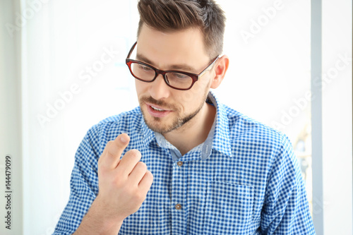 Young man with contact lens...