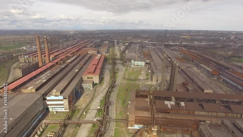 Aerial view of industrial steel plant. Aerial sleel factory. Flying over smoke steel plant pipes. Environmental pollution. Smoke. photo