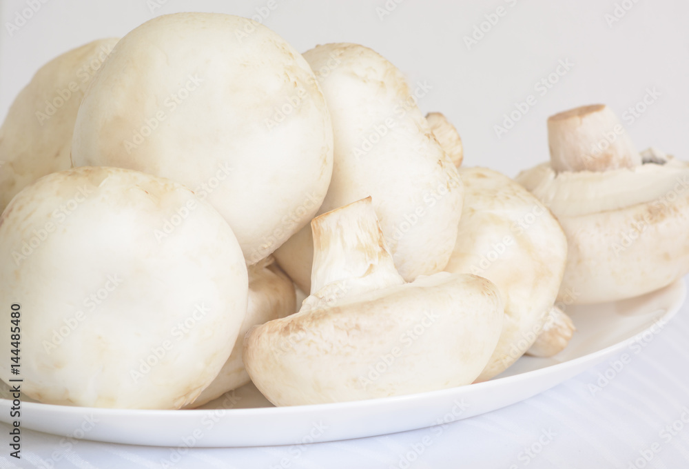 Champignons on a white plate