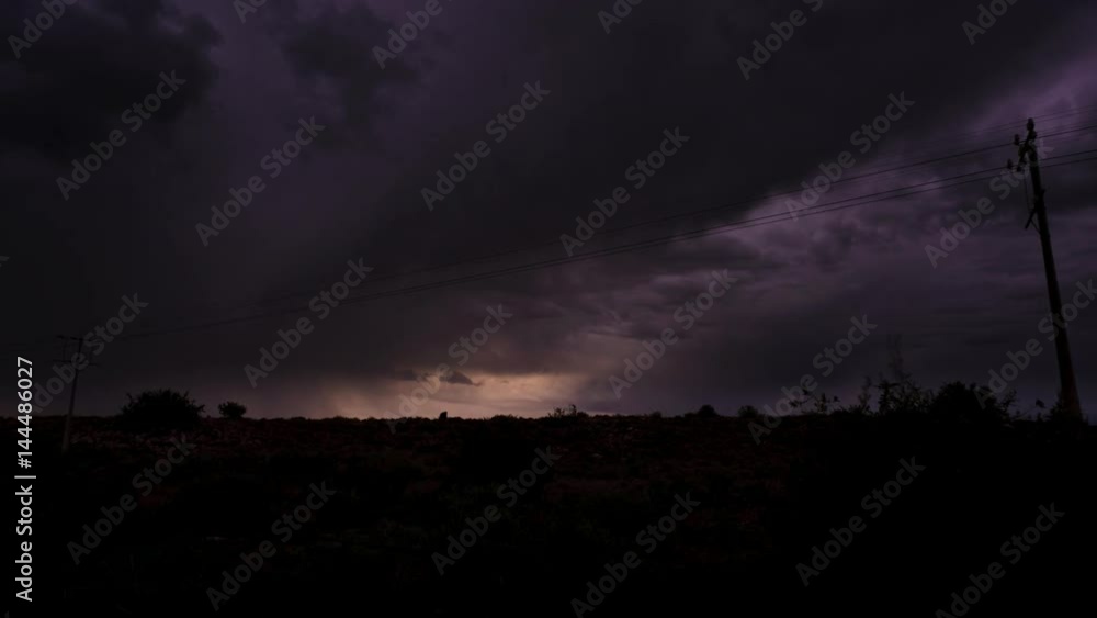 A static timelapse of a typical Karoo scene with a dramatic thunderstorm and dark clouds moving through, framed by telephone poles available on request. A static timelapse of a typical Karoo scene with a dramatic thunderstorm and dark clouds moving through, framed by telephone poles available on request.