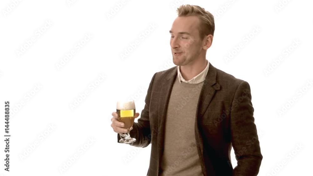 Happy man in a brown suit and beige shirt holdng a great tasting beer with a big smile on his face, White background. Happy man in a brown suit and beige shirt holdng a great tasting beer with a big smile on his face, White background.