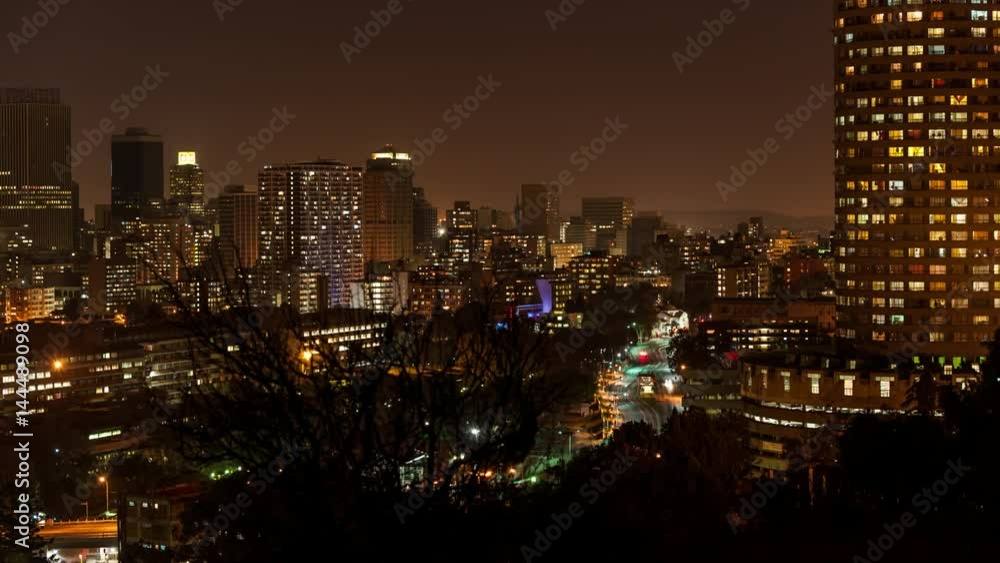 Medium night timelapse panning across Ponte Towers and the city centre of Johannesburg during peak traffic with streets and buildings, South Africa Medium night timelapse panning across Ponte Towers and the city centre of Johannesburg during peak traffic with streets and buildings, South Africa