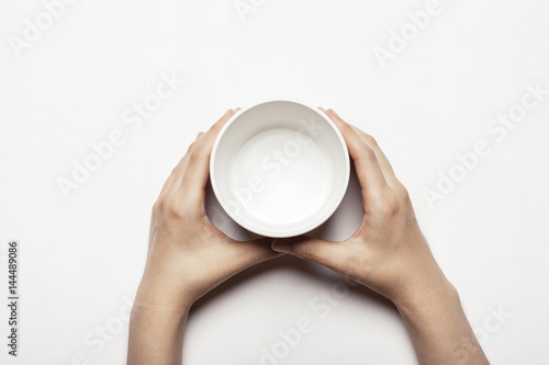 woman female  hand hold a white ceramic box isolated white.