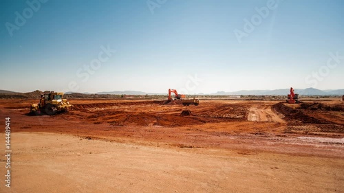 Wallpaper Mural Static pan timelapse of a construction site on a mine while earthworks is in progress with heavy load machinery, trucks and tippers close to action Torontodigital.ca