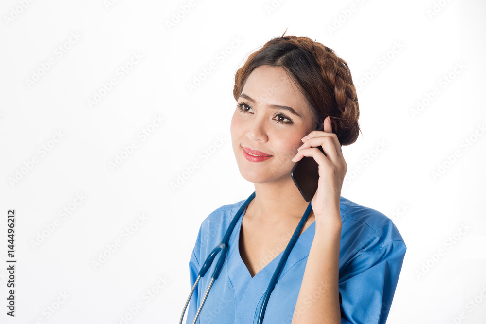 Asian female medical nurse using smart phone on white background Asian female medical nurse using smart phone on white background