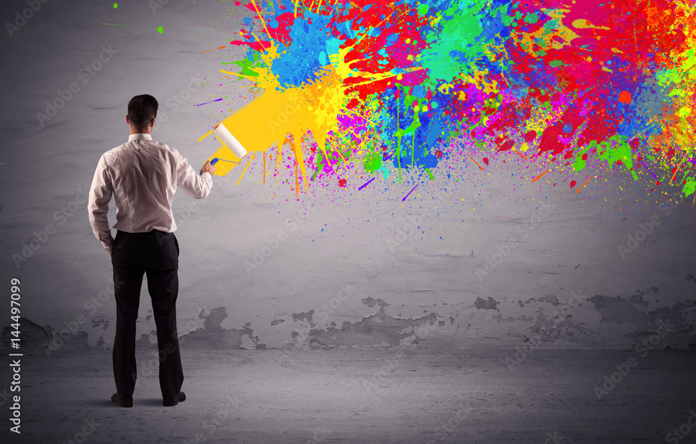 Sales person painting colorful splatter Sales person painting colorful splatter