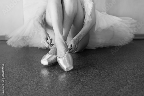 Long legs of ballerina in toeshoe photo