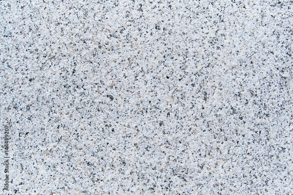 White-gray granite texture for background. Natural granite surface pattern as background White-gray granite texture for background. Natural granite surface pattern as background
