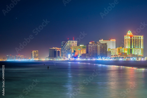 The skyline and Atlantic Ocean at night, in Atlantic City, New Jersey.