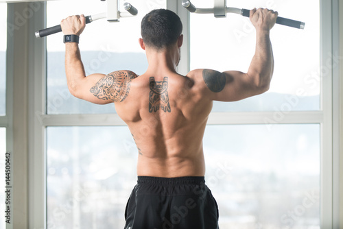 Bodybuilder Doing Pull Ups Best Back Exercises