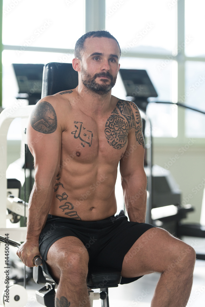 Muscular Man Exercising Triceps On Machine Muscular Man Exercising Triceps On Machine