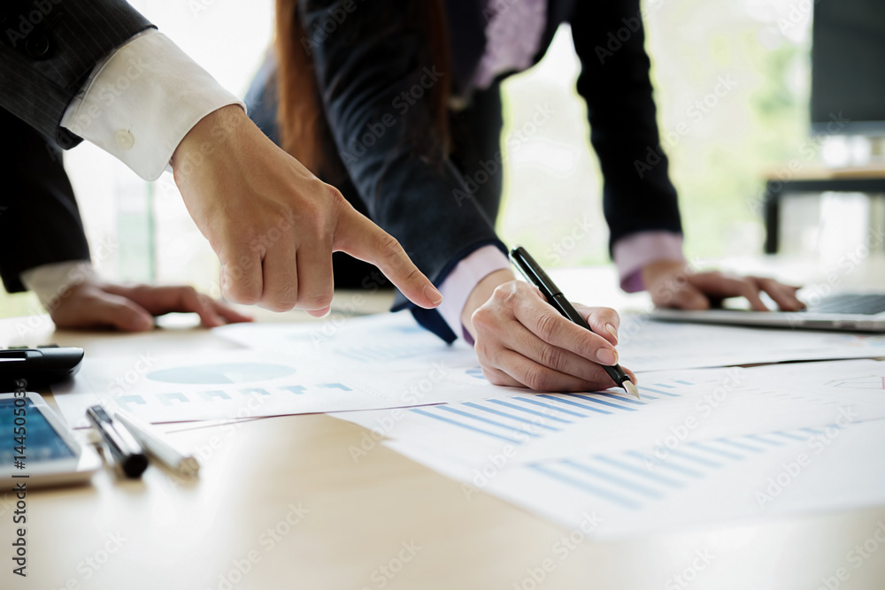 Business concept. Business people discussing the charts and graphs showing the results of their successful teamwork. Selective focus. Business concept. Business people discussing the charts and graphs showing the results of their successful teamwork. Selective focus.