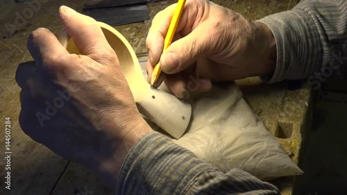 The Man Carves In The Wood. Folk Craft. Wood. Folk Technology. 4k Resolution photo