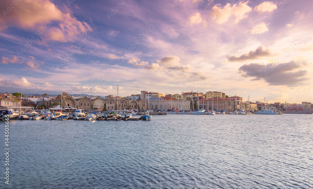 The beautiful old harbor of Chania, at sunset, Crete, Greece.