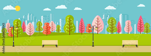 Public spring park with pink, red, green trees and a view of city.