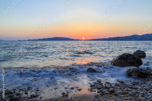 Beuatiful waves of mediterranean sea during sunset near hisaronu, marmaris