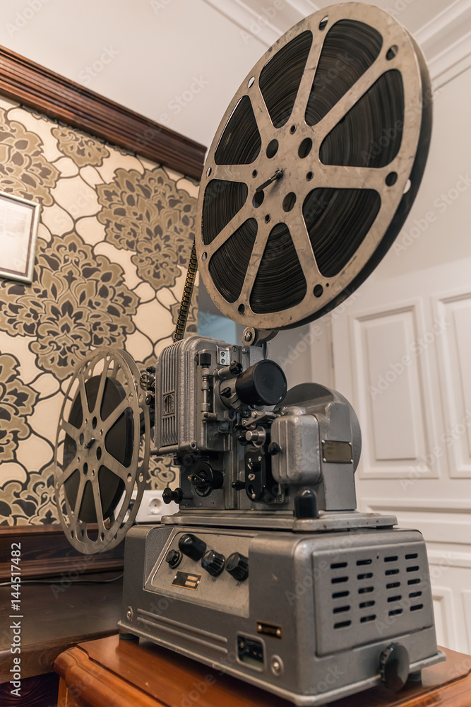 Vintage metal movie projector with film reel Stock Photo
