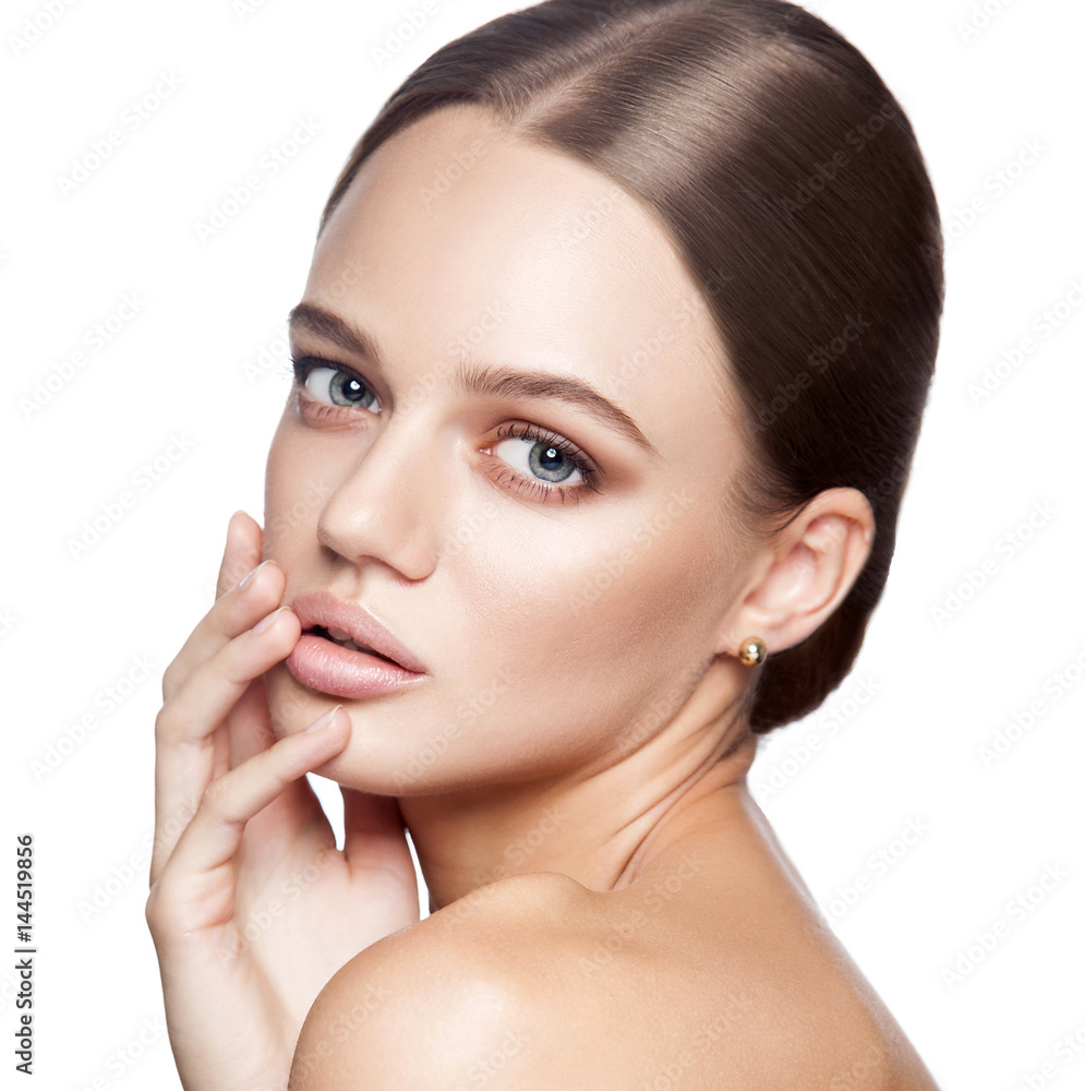 Calm beauty. Portrait of beautiful young blonde woman with nude makeup, blue eyes, hairstyle and clean face. Studio shot, Isolated on white background.