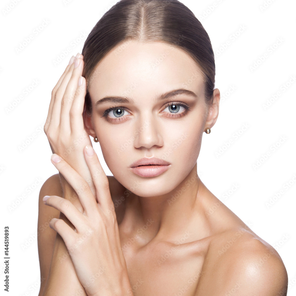 Calm beauty. Portrait of beautiful young blonde woman with nude makeup, blue eyes, hairstyle and clean face. Studio shot, Isolated on white background. Calm beauty. Portrait of beautiful young blonde woman with nude makeup, blue eyes, hairstyle and clean face. Studio shot, Isolated on white background.