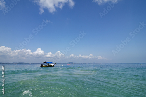 Fototapeta Naklejka Na Ścianę i Meble -  scenic sea view of the Kapas Island at Terengganu, Malaysia. Clear sea water and blue sky background