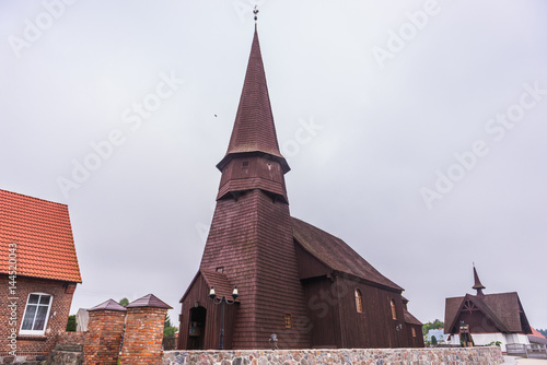 Old wooden Exaltation of the Holy Cross Church in Lesno town, Cassubia region of Poland photo