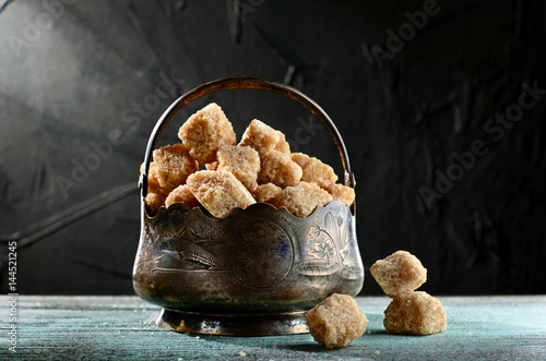 Fotografie cane sugar,  sugar bowl on wooden table old style