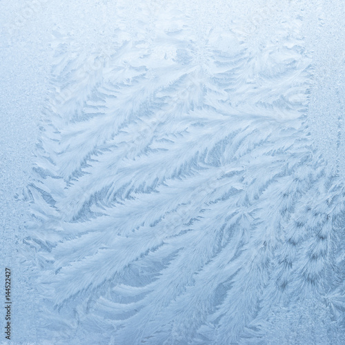 Hoarfrost. Winter background - ice crystals on window