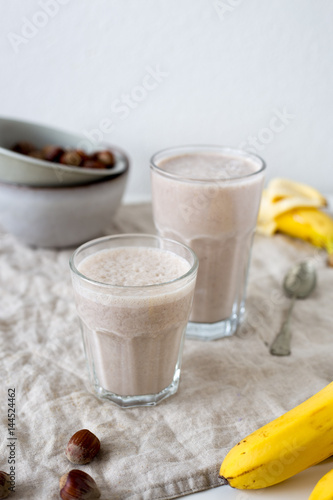 Banana smoothie with hazelnut milk. Vegan food concept