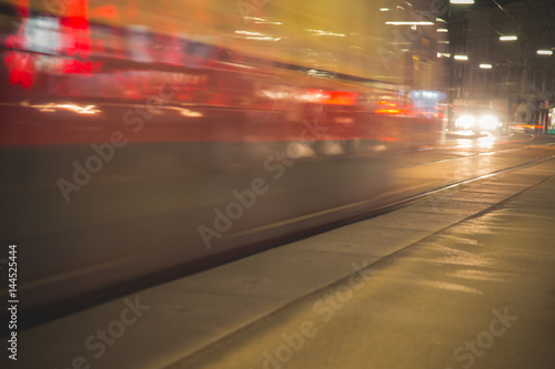 : Tramway blurred motion. Public transport night scene. 