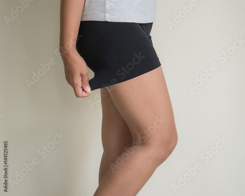 Fat thighs, cellulite of of middle-aged women.