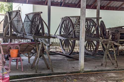 Traditional wooden carts parked under the porch on a farm, Nakhon Nayok, Thailand
