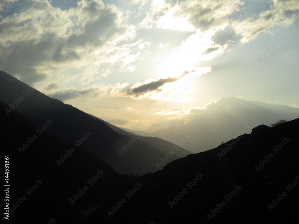 Obraz premium Russia, Caucasia, ingushetia. Silhouette of mountain on cloudy gray sky background, horizontal view.