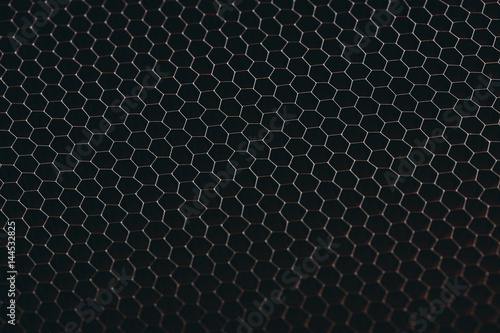 abstract texture honeycomb. Metallic net background or texture. metal mesh. full frame colourful illuminated detail of a metallic grid in front of a loudspeaker