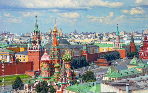 View on Moscow Red Square, Kremlin towers, stars and Clock Kuranti, Saint Basil's Cathedral church, Lenin mausoleum. Panorama from hotel Russia. Moscow holidays vacation tours famous sightseeing Putin
