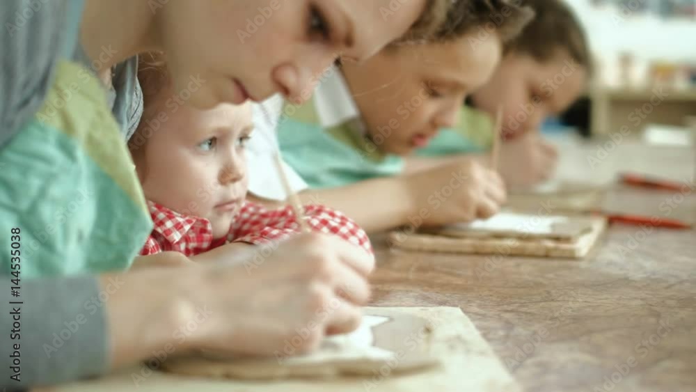 clay potter hands wheel pottery work workshop teacher and girl pupil 4k clay potter hands wheel pottery work workshop teacher and girl pupil 4k