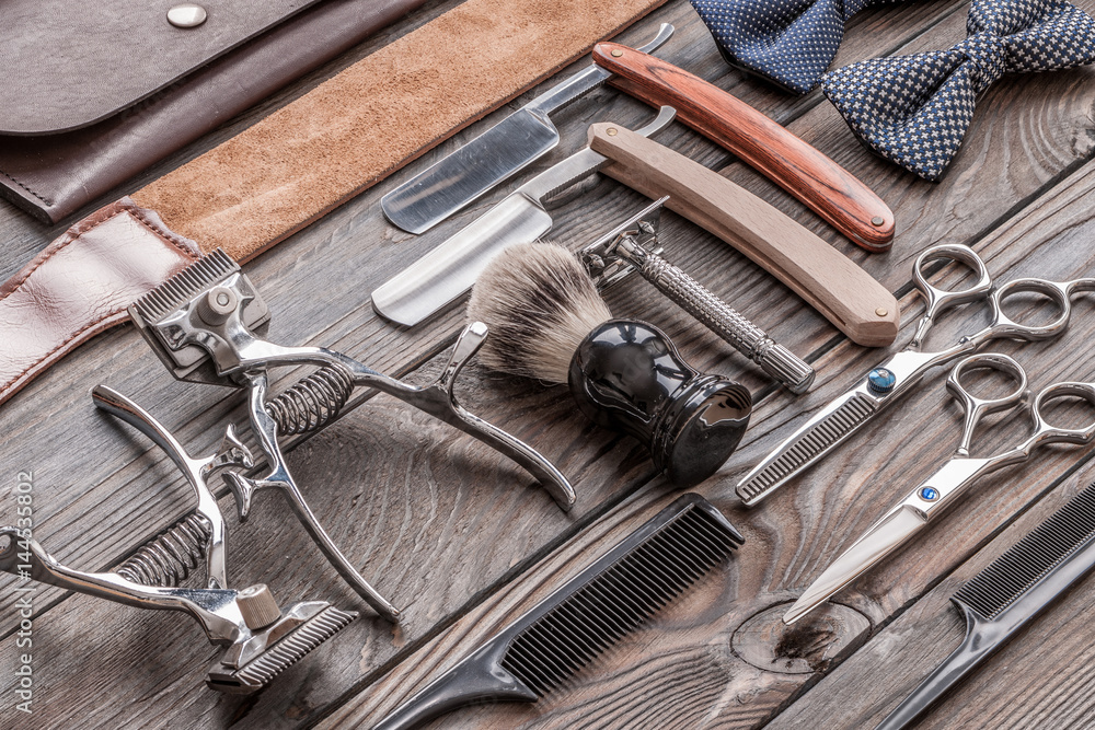 Fototapeta premium Vintage barber shop tools on wooden background