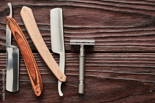 Photography Vintage barber shop razor tools on wooden background