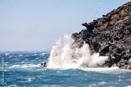 Ocean waves hits the rocks.