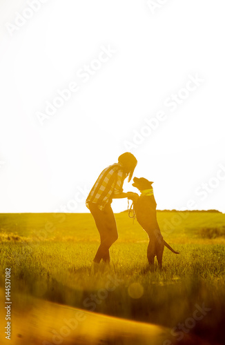Teen woman posing with her dog