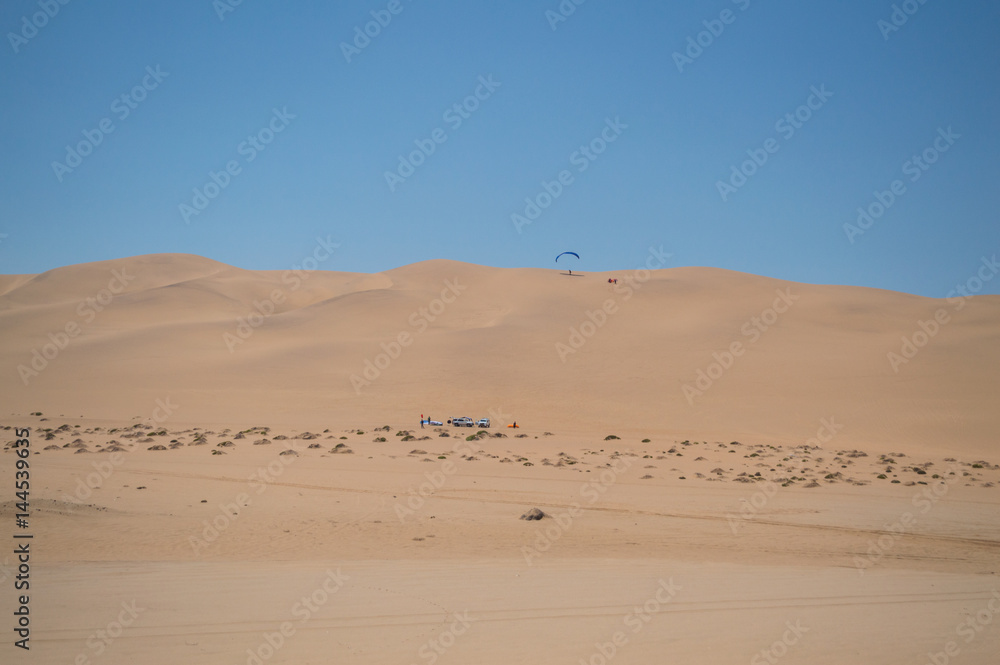 Parasailing off a Sand Dune near Swakopmund, Namibia Parasailing off a Sand Dune near Swakopmund, Namibia