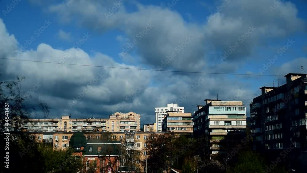 Time lapse with dramatic bubbling and boiling clouds moving over city with high rise buildings. The clouds periodically cast shadows onto city and produce alternating dusk and daylight. Time lapse with dramatic bubbling and boiling clouds moving over city with high rise buildings. The clouds periodically cast shadows onto city and produce alternating dusk and daylight.